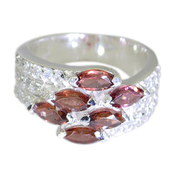 Ivy luxurious red gemstone ring on silver band with marquise red stones and pave clear crystals