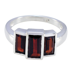 Antonia luxurious red trilogy ring with three rectangular red gemstones set in a silver band