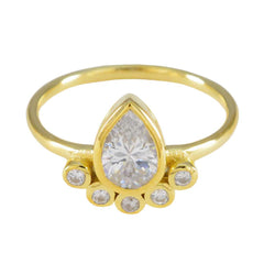 Ji-eun luxurious white gemstone ring featuring a pear-shaped center stone with gold band