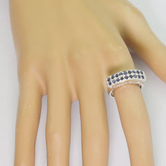 Nisa luxury blue gemstone ring with two rows of blue stones on silver band worn on finger