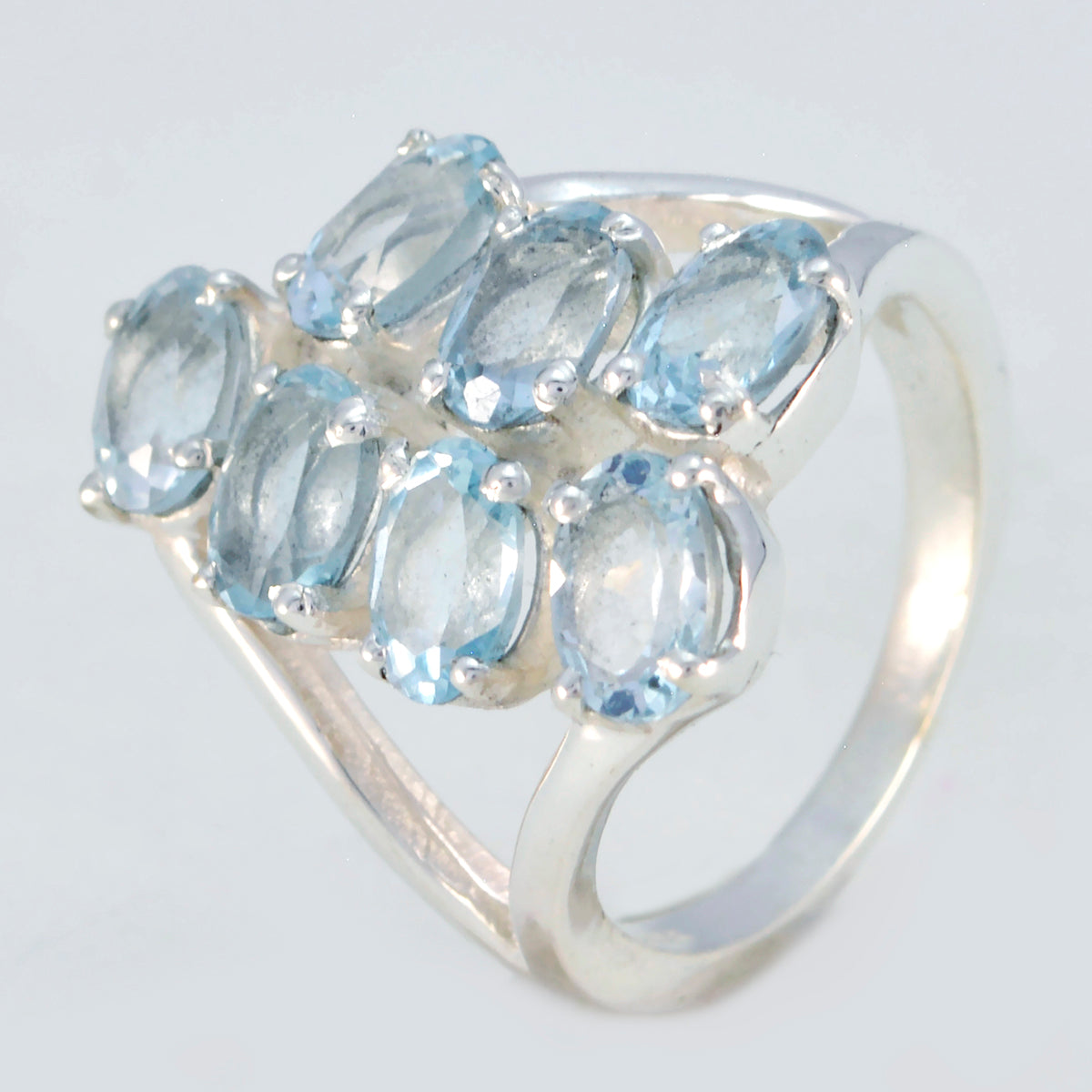 Lourdes luxury gemstone hepta ring with seven light blue gemstones set in silver band