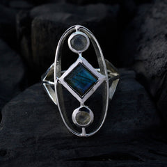 Rosa luxury grey gemstone ring with geometric design featuring a blue diamond and two round stones