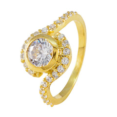 Lourdes luxury halo ring for women in gold with a large central diamond and smaller surrounding stones
