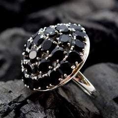 Camilla modern black statement ring with multiple black stones set in silver metal band