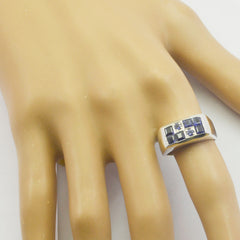 Victoria silver band modern blue gemstone ring with square blue stones set in a row on mannequin hand