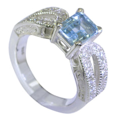 Julia modern blue halo ring with square blue gemstone and intricate silver detailing