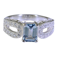 Julia modern blue halo ring with square blue gemstone and sparkling diamond accents on silver band