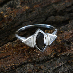 Eun-ji modern brown gemstone ring with marquise cut brown stone and triangular clear side stones on silver band
