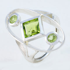 Sara modern green gemstone ring with square peridot center and two round peridot accents in sterling silver