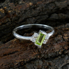 Saanvi modern green gemstone ring with rectangular green stone and small clear accent stones on silver band