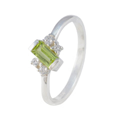 Saanvi modern green gemstone ring with rectangular green stone and small clear stones on silver band