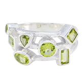 Natcha sterling silver multi stone peridot band featuring varied cuts modern green gemstone ring