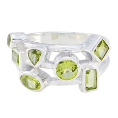 Natcha sterling silver multi stone peridot band featuring varied cuts modern green gemstone ring