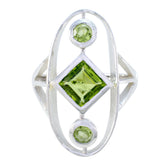 Sara modern green gemstone ring with square peridot center and two round peridot accents in silver
