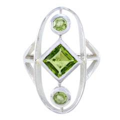 Sara modern green gemstone ring with square peridot center and two round peridot accents in silver