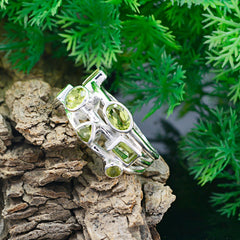 Natcha modern green gemstone ring silver band with multiple faceted green stones in mixed shapes