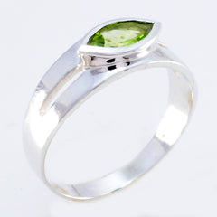 Antonia modern green solitaire ring with marquise cut green stone set in silver band