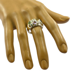 Priya modern multicolor gemstone ring on mannequin hand silver band with green and purple stones