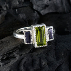 Dayana modern multicolor trilogy ring with rectangular green center stone and two purple side stones in silver setting