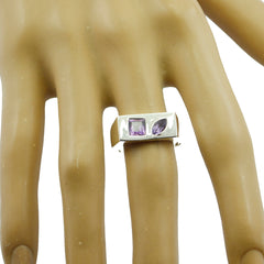 Laura modern purple toi et moi ring with square and marquise purple stones on silver band worn on finger