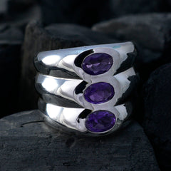 Emily modern purple trilogy ring with three oval purple stones set in polished silver band