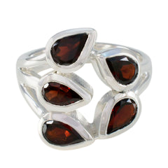 Natcha modern red gemstone ring featuring five pear-shaped red stones set in silver band