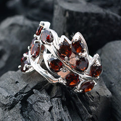 Dewi modern red gemstone ring with multiple deep red stones set in intricate silver design