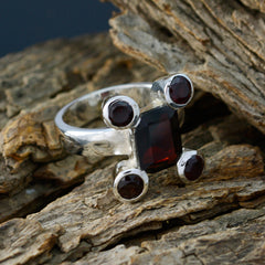Siti modern red gemstone ring with square center stone and four round accent stones on silver band