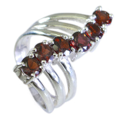 Rosa modern red gemstone ring with multiple round red stones set on a silver band
