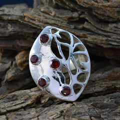 Mila modern red gemstone ring with five red stones set in a silver abstract openwork design