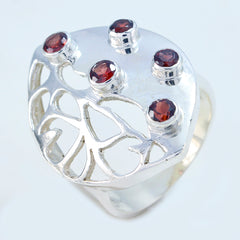 Mila modern red gemstone ring with five red stones set in a silver openwork design