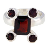 Siti modern red gemstone ring with square center stone and four round accent stones in silver setting