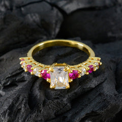 Siti modern red gemstone ring gold band with rectangular clear center stone and pink side gems