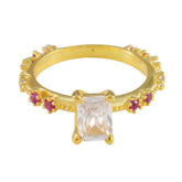 Liyana modern red gemstone ring gold band with rectangular clear center stone and small ruby accents