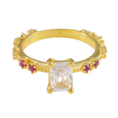 Liyana modern red gemstone ring gold band with rectangular clear center stone and small ruby accents