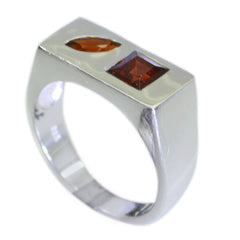 Lorena modern red gemstone ring with silver band featuring square and marquise red gemstones