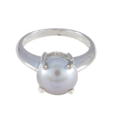 Isla modern solitaire ring featuring a single large pearl set on a polished silver band