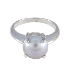 Isla modern solitaire ring featuring a single large pearl set on a polished silver band