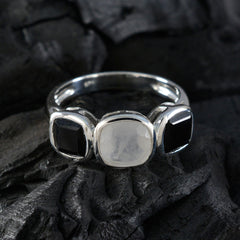 Ines modern trilogy ring with black and white stones set in silver band