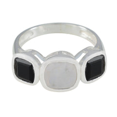 Ines silver modern trilogy ring with two black stones and one white stone in the center