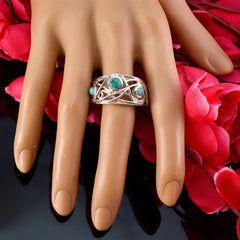 Layla modern turquoise trilogy ring with three turquoise stones on silver band worn on hand