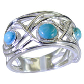Layla modern turquoise trilogy ring with silver intricate openwork design and three turquoise stones