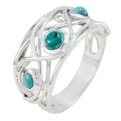 Layla modern turquoise trilogy ring with three turquoise stones set in an intricate silver band
