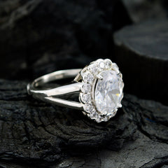 Ayesha modern white halo ring with a large central stone surrounded by smaller diamonds on a silver band