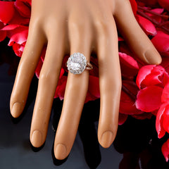Ayesha modern white halo ring with sparkling center stone and surrounding diamonds displayed on a hand model