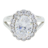 Ayesha modern white halo ring featuring an oval center stone surrounded by smaller sparkling diamonds