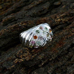 Lea multicolor abstract ring silver band with mixed pastel gemstones and ribbed wave design on bark