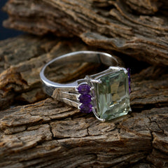 Layla multicolor cocktail ring with large green gemstone and small purple stones on silver band