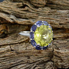 Lily multicolor cocktail ring with large yellow center stone and surrounding blue gemstones on silver band
