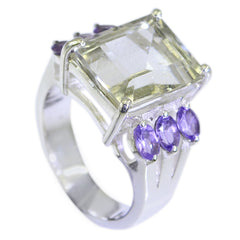 Layla multicolor cocktail ring with large clear center stone and purple side gemstones in silver band